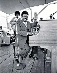  ??  ?? Fats Domino at the New Orleans Jazz & Heritage Festival, 1977: imbued with joyful boogiewoog­ie and pounding roadhouse piano, his songs became staples of the R & B repertoire