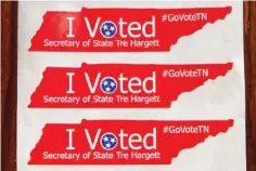  ?? AP PHOTO/ ERIK SCHELZIG ?? New “I Voted” stickers featuring the name of Republican Secretary of State Tre Hargett are displayed on Friday in Nashville.