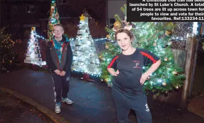  ??  ?? A Christmas tree trail has been launched by St Luke's Church. A total of 54 trees are lit up across town for people to view and vote for their
favourites. Ref:133234-11