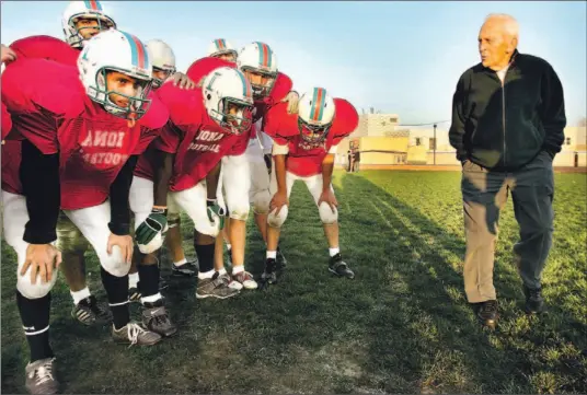  ?? HANS DERYK/TORONTO STAR ?? Former CFL and Toronto Argos star Nobby Wirkowski, now working as a scout and advisor for his son’s team at Iona Secondary, surveys the troops during a recent practice.