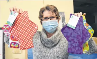  ?? SHARON MONTGOMERY-DUPE • CAPE BRETON POST ?? Neila Buchanan with ACAP Cape Breton, holds up washable sanitary pads being sold at the ACAP eco store on the Esplanade in Sydney.