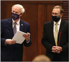  ?? (Arkansas Democrat-Gazette/Thomas Metthe) ?? Gov. Asa Hutchinson (left) and state Health Secretary Nate Smith confer before the start of Wednesday’s briefing, held at the University of Central Arkansas in Conway.