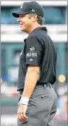  ?? AP PHOTO ?? First base umpire James Hoye waits for play during the first inning of a game between the Chicago White Sox and the Texas Rangers Saturday in Arlington, Texas.