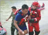  ?? PROVIDED TO CHINA DAILY ?? A rower is rescued after two dragon boats capsized in Guilin, Guangxi Zhuang autonomous region, on Saturday.