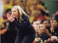  ?? Matthew Putney / Associated Press ?? Baylor coach Nicki Collen encourages the team during the second half against Iowa State on Feb. 28.