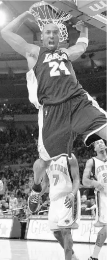  ?? KATHY WILLENS/AP ?? In this Feb. 2, 2009, photo Los Angeles Lakers guard Kobe Bryant reacts after a slam dunk against the Knicks in Madison Square Garden. Bryant scored 61 points in the game. Bryant, the 18-time NBA All-Star who won five championsh­ips and became one of the greatest basketball players of his generation during a 20-year career with the Lakers, died in a helicopter crash Sunday.