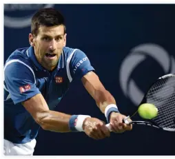  ??  ?? ON COURSE: Novak Djokovic reaches for a shot from Radek Stepanek at the Rogers Cup tennis tournament in Toronto, Thursday night. (AP)