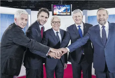  ?? Joel Lemay / the cana dian press ?? From left: Bloc Quebecois leader Gilles Duceppe, the Liberals’ Justin Trudeau, journalist and moderator Pierre Bruneau, Conservati­ve Leader Stephen Harper and the NDP’s Tom Mulcair before the start of a French-language debate in Montreal on Friday.