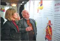  ?? PROVIDED TO CHINA DAILY ?? Visitors learn about traditiona­l Chinese culture at a picture exhibition, part of the Charming Beijing cultural promotiona­l series in the United States in January.