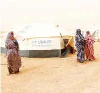  ?? Reuters ?? Libyan women displaced from the town of Tawergha are seen at a camp in the Garart Al Gatef, Libya . —