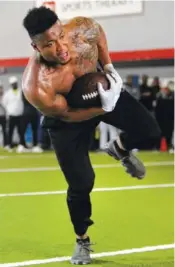  ?? STAFF PHOTO BY ERIN O. SMITH ?? Linebacker Tae Davis catches a pass during UTC’s pro day Tuesday at D1 Sports Training.