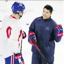  ?? ALLEN McINNIS FILES ?? Laval Rockets defenceman Noah Juulsen, a six-footer, chats with playerdeve­lopment coach Francis Bouillon, who says regardless of a player’s size, success in the NHL “all starts from the attitude.”