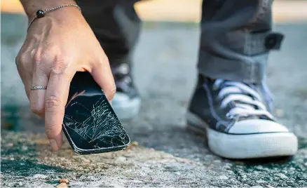  ?? ?? Accidents happen. Waterlogge­d hardware and cracked screens are common phone mishaps. (AdobeStock)