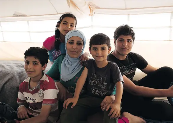  ?? DEBRA KELLNER ?? Zahra and her four children spend time in a refugee camp while en route to Europe. The film Inside My Heart is named after words the widow shared with her youngest son.