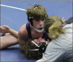  ?? Scott Herpst ?? Ringgold’s Parker Gill looks to the referee for a call on a pin during the Gordon Lee Duals last Tuesday.