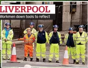  ?? ?? LIVERPOOL Workmen down tools to reflect