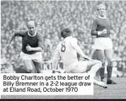  ??  ?? Bobby Charlton gets the better of Billy Bremner in a 2-2 league draw at Elland Road, October 1970