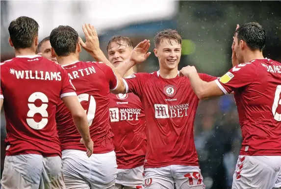  ?? Picture: Joe Giddens/PA ?? Bristol City’s George Tanner, second right, celebrates scoring his first goal for the club