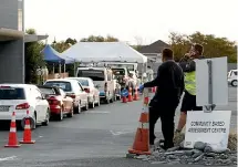  ??  ?? A queue of cars at the Tahunanui, Nelson Community Based Assessment Centre at sunset after a Nelson woman in her 30s was confirmed to be carrying Covid19, in a case suspected to be related to travel.