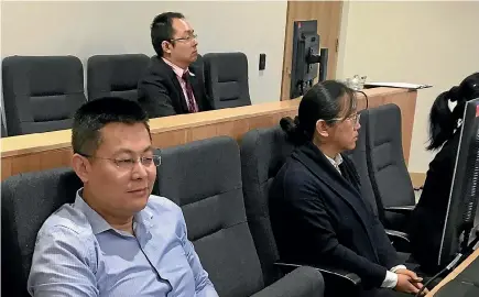  ?? STUFF ?? From left: Gang Chen, former BNZ employee Zongliang Jiang (at rear), and Kang Xu have been found guilty of charges laid by the Serious Fraud Office.