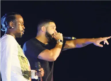  ??  ?? Popcaan and Canadian Superstar Drake performing on stage.