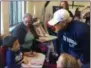  ?? BY PAUL POST ?? Bucky Dent, right, chats with a young Yankee fan during a Thursday visit to the Prospect Center in Queensbury.