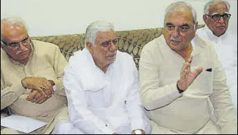  ?? HT PHOTO ?? Former chief minister Bhupinder Singh Hooda (2nd R) with Congress leaders (from left) Anand Singh Dangi, Raghuvir Singh Kadian and Shadi Lal Batra at a press conference in Rohtak.
