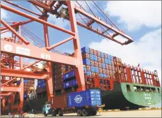  ?? Getty Images ?? A truck move containers at a port in Lianyungan­g in China’s eastern Jiangsu province.