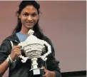  ??  ?? INVENTOR: Kiara Nirghin, 16, holds her Google Science Fair trophy.