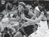  ?? Mark Humphrey / Associated Press ?? Kentucky's Rhyne Howard, left, is guarded by LSU's Khayla Pointer in the second half of Friday’s game.