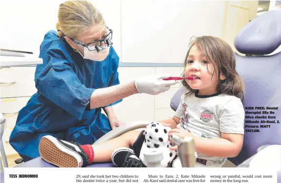  ??  ?? KIDS FREE: Dental therapist Eliz De Silva checks Ezra Mikaele Ah-kuoi, 2. Picture: MATT TAYLOR.