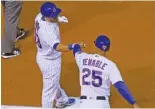  ?? CHARLES REX ARBOGAST/AP ?? The Cubs’ David Bote (left) celebrates with thirdbase coach Will Venable after his two-run triple in the second inning.