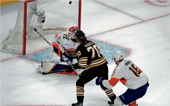  ?? MICHAEL DWYER/ASSOCIATED PRESS ?? Jesper Boqvist beat Panthers goalie Sergei Bobrovsky in overtime as the Bruins completed a sweep of the teams’ season series.