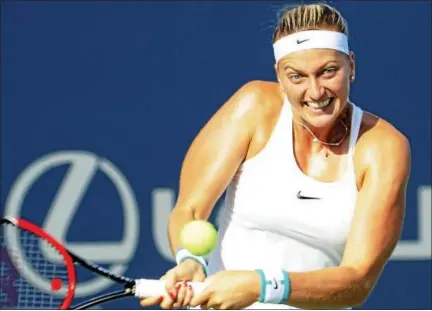  ?? BOB CHILD — FOR THE REGISTER ?? Petra Kvitova hits a backhand return to Ekaterina Makarova in their quarterfin­al match at the Connecticu­t Open on Thursday.