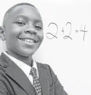  ?? Trish Johnson / For the Chronicle ?? Fielder Elementary School fifth-grader Joshua Okolo has been named Grand Prize winner of the 2015 Texas Summer THINK Challenge.