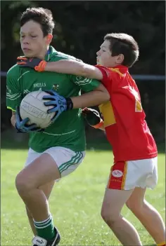  ??  ?? Jake Scallan of Kilmore is tackled by Richard Rice (Horeswood).