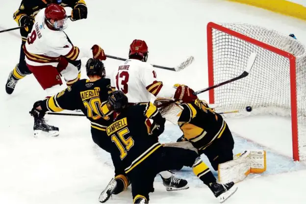  ?? BARRY CHIN/GLOBE STAFF ?? Ryan Leonard (left) tallied twice for Boston College, which turned it on late to beat Michigan Tech in the first round of the NCAA Tournament.