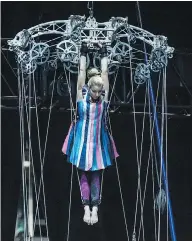  ??  ?? Left, Simon Bukin of Belarus as he practises on the high bar. Right, a Cirque du Soleil’s performer tests equipment.