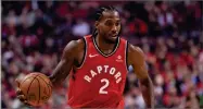  ?? AP PHOTO BY NATHAN DENETTE ?? Toronto Raptors forward Kawhi Leonard takes the ball up court during first half NBA basketball action in Toronto on Wednesday, Oct. 17.