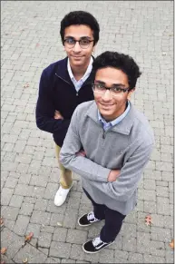  ?? H John Voorhees III / Hearst Connecticu­t Media ?? Adam Bhavnagarw­ala, right, and his twin brother Ibrahim , seniors at Danbury High School, have created a prototype for an invention that can detect toxic/harmful/flammable gasses at extremely low concentrat­ions and sooner than convention­al smoke detectors/sensors.