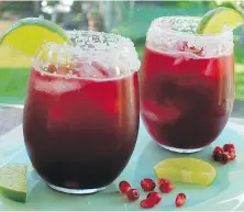  ??  ?? Toast Cinco de Mayo with lime and pomegranat­e margaritas.