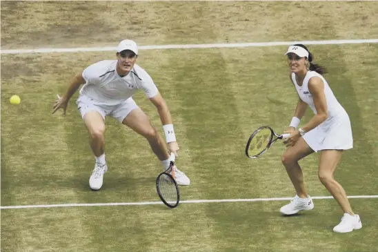  ??  ?? 2 Jamie Murray and Martina Hingis were in terrific form as they sealed a 6-4, 6-4 victory to secure the Wimbledon Mixed Doubles title in front of a packed Centre Court.