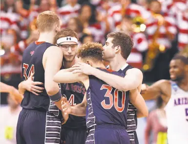  ?? Gene Sweeney Jr. / Getty Images ?? St. Mary’s players gather themselves late in the game as Arizona pulled away to a second-round win.