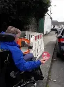  ??  ?? Disability activist John Morgan shows how works blocked access .