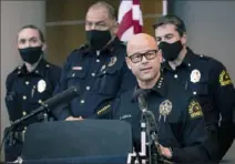  ?? Lynda M. Gonzalez/The Dallas Morning News via AP ?? Chief Eddie Garcia, center, speaks Thursday during a news conference at Dallas Police Headquarte­rs on the arrest and murder charges against Officer Bryan Riser.