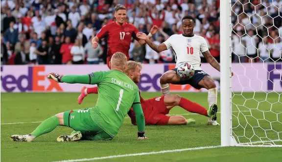  ?? Picture: Laurence Griffiths/Getty ?? Denmark’s Simon Kjaer turns the ball past his own goalkeeper Kasper Schmeichel for England’s equaliser at Wembley