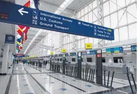  ?? CHICAGO TRIBUNE BRIAN CASSELLA/ ?? Internatio­nal Terminal 5 was quiet earlier this year at O’Hare Internatio­nal Airport in Chicago. The lack of visitors from other countries leaves a hole in our city this summer.