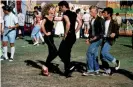  ??  ?? Newton-John with John Travolta in 1978’s Grease. Photograph: Allstar/Paramount Pictures