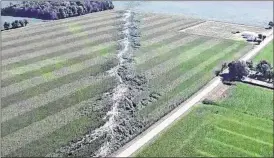  ?? CONTRIBUTE­D ?? The path of a tornado can be seen in crop damage in a field in Darke County.