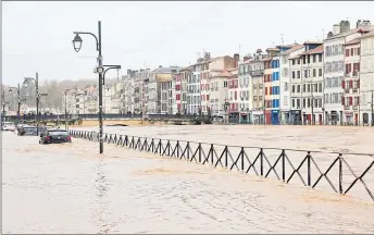  ?? ?? Photo shows flooded streets in Bayonne, southweste­rn France. — AFP photo